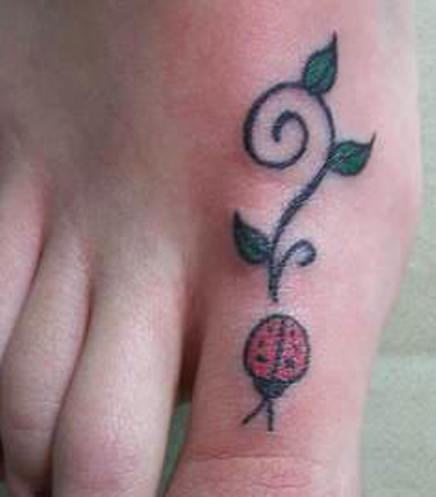 Simple ladybug foot tattoo