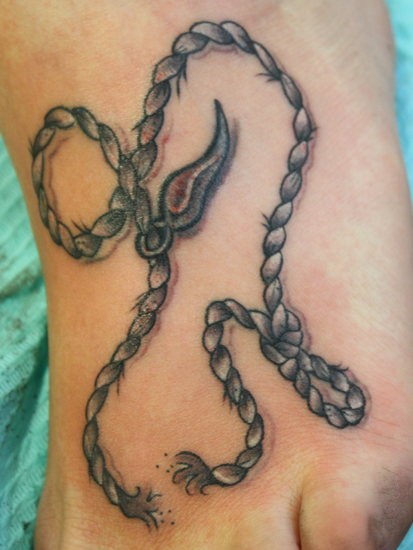 Simple rope foot tattoo