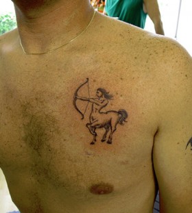 Simple sagittarius chest tattoo