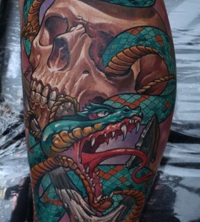 Skull and snake tattoo by Dmitriy Samohin