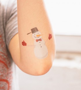 Small snowman arm tattoo
