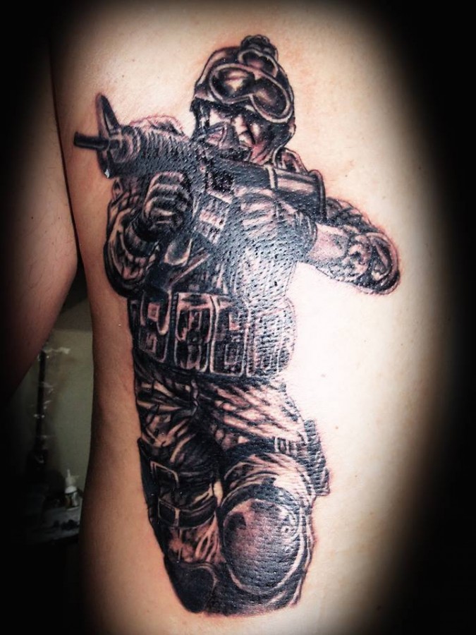 Soldier with a gun tattoo