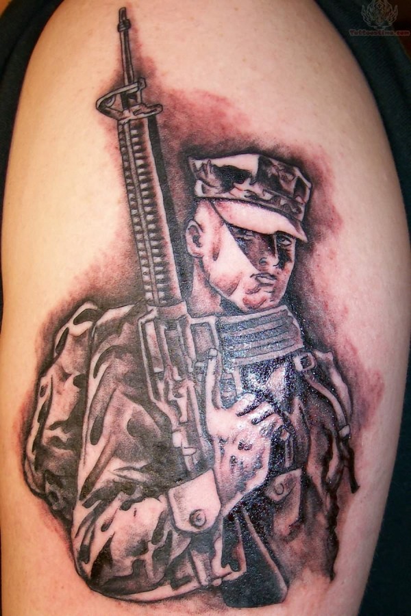 Soldier with gun tattoo