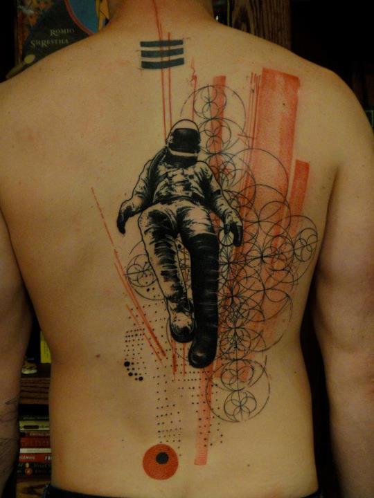 Spaceman xoil back tattoo