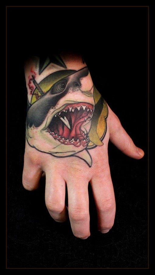 Stabbed shark hand tattoo