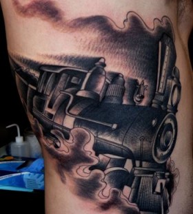 Steaming train side tattoo