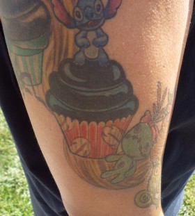 Stitch and cupcake tattoo