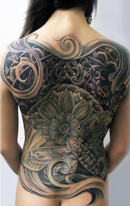 Stunning moth back tattoo