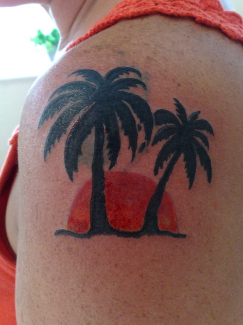 Sunset and palm tree tattoo