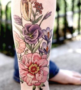 Sweet flowers leg tattoo by Alice Kendall