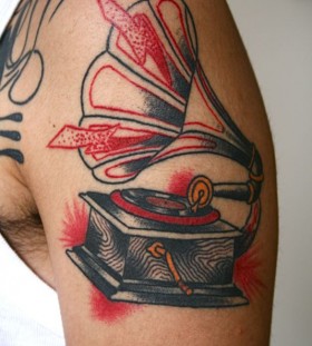 Sweet gramophone arm tattoo