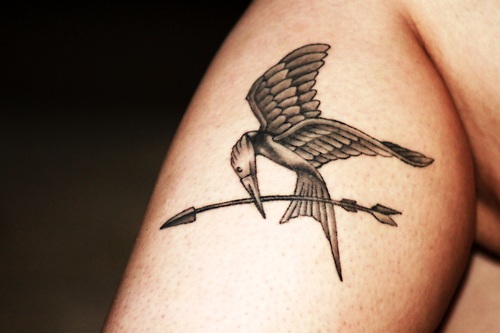 Sweet mockingjay leg tattoo