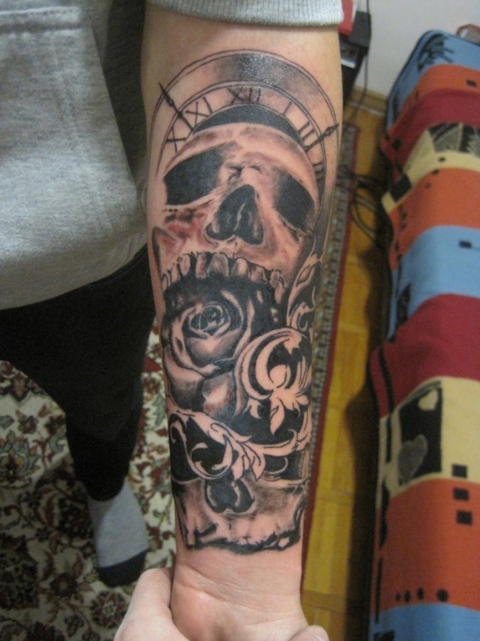 Sweet skull clock arm tattoo