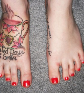 Teacup and writing foot tattoo