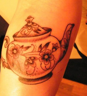 Teapot with flowers tattoo
