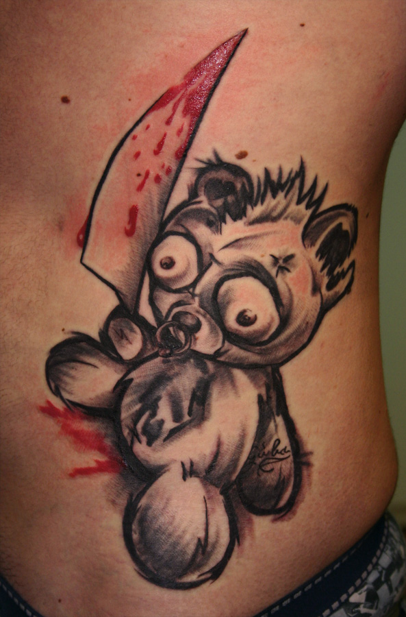 Teddy bear with a knife tattoo