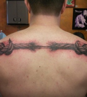 Torn rope back tattoo