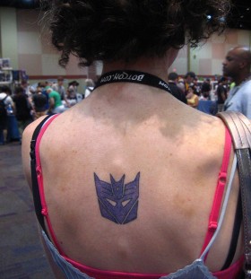 Transformers logo back tattoo