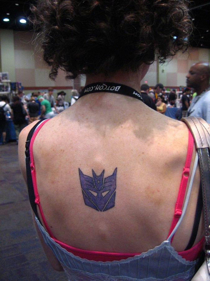 Transformers logo back tattoo