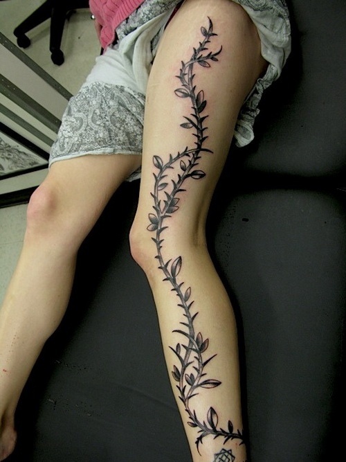 Tree branch leg tattoo