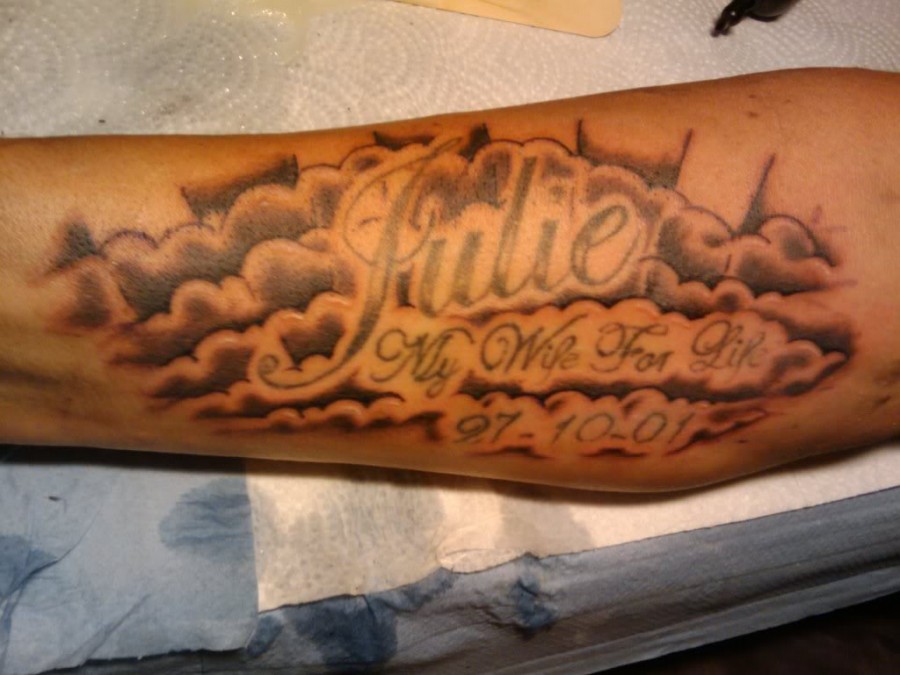 Tribute cloud arm tattoo