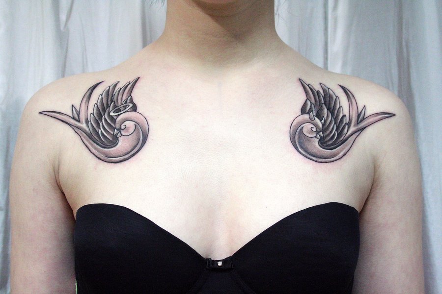 Two swallows collarbone tattoo