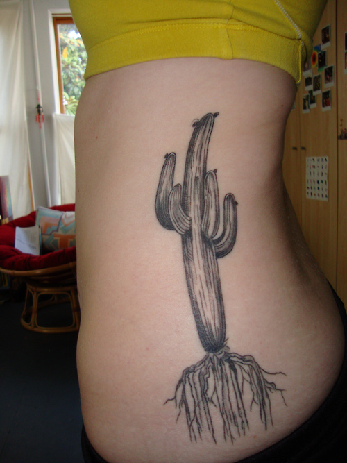 Uncoloured cactus side tattoo