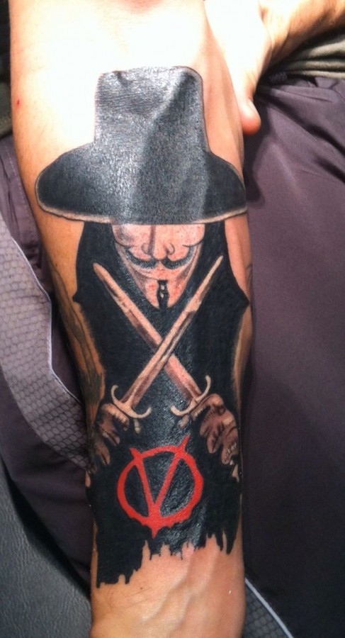 V with daggers arm tattoo