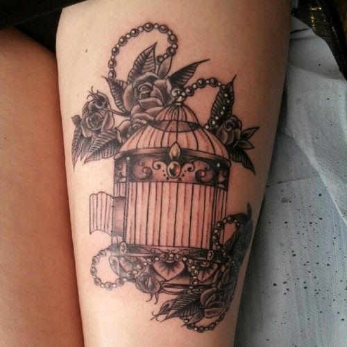 Vintage birdcage and flowers tattoo