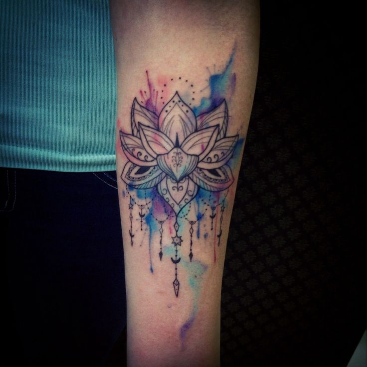 Watercolour lotus flower tattoo by Tyago Compiani