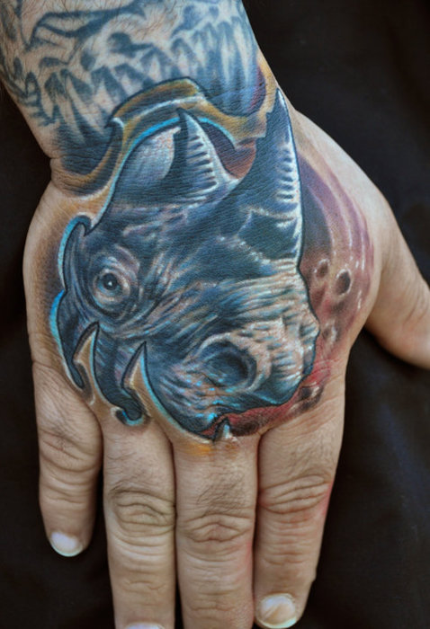 Weird rhino hand tattoo