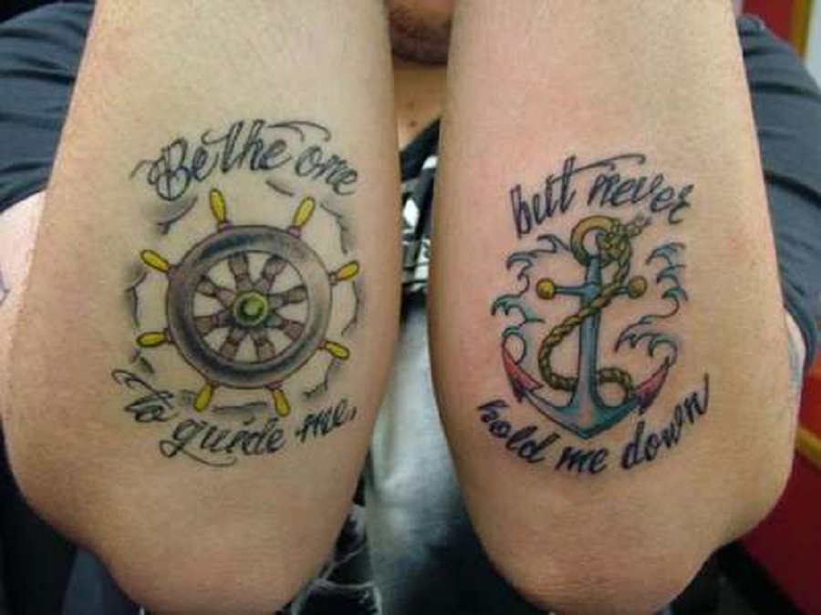 Wheel and quote tattoo