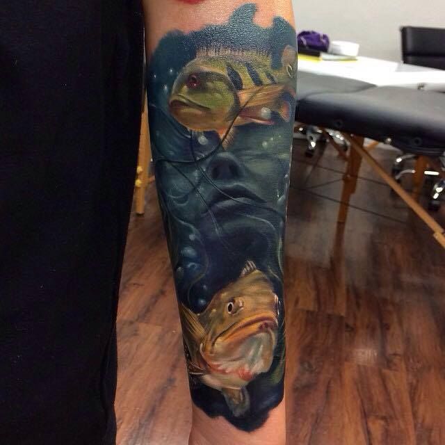 Woman and fish tattoo by Kyle Cotterman