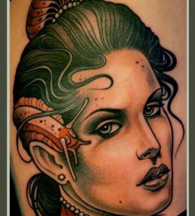 Woman and snail tattoo by Lars Uwe Jensen