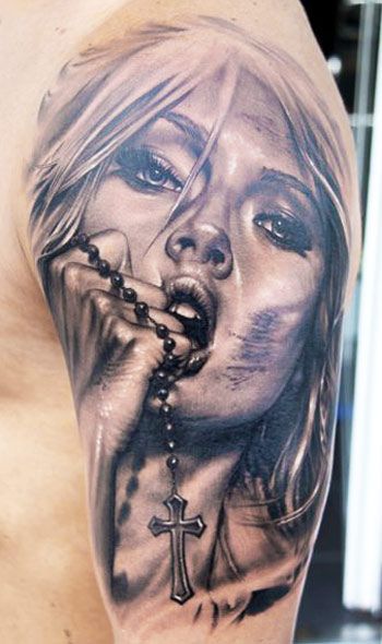 Woman with cross tattoo by James Tattooart