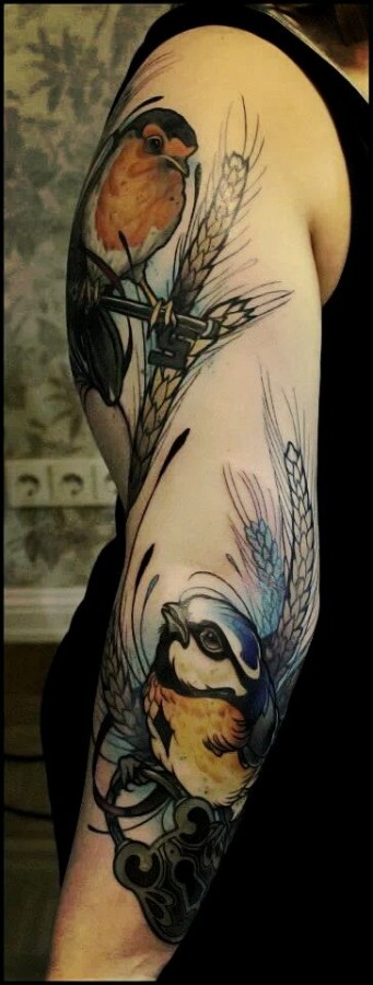 Wonderful birds arm tattoo