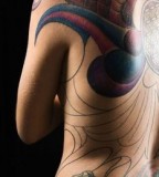 Wonderful Blade Tattoo at Woman's Back