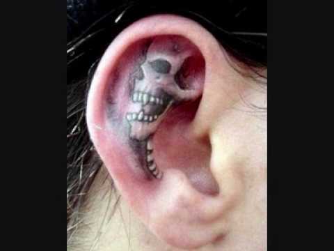 Unique Skull Formed Tattoo Picture on Right Ear