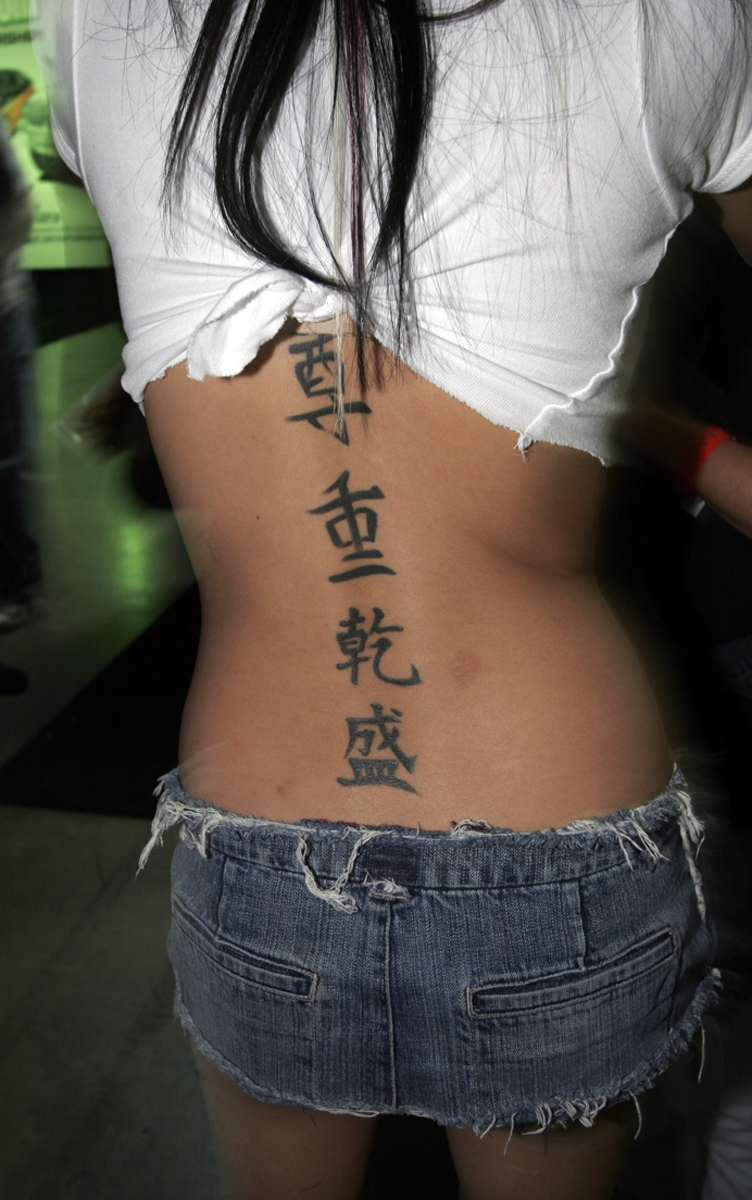 Kenji Shaped Tattoo Design on Back for Girls