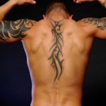 Tribal Vertebral Column Tattoo Designs For Men