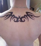 Simple Tribal Tattoo On Upper Back