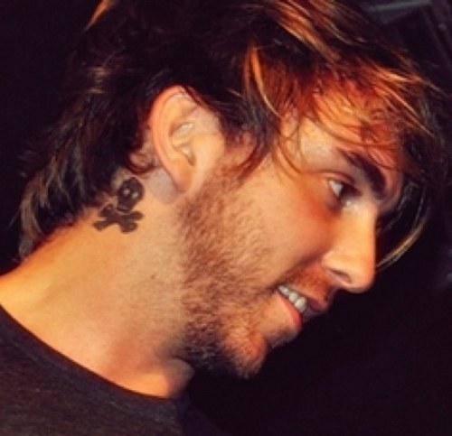 Skull Behind Alexs Ear Tattoo