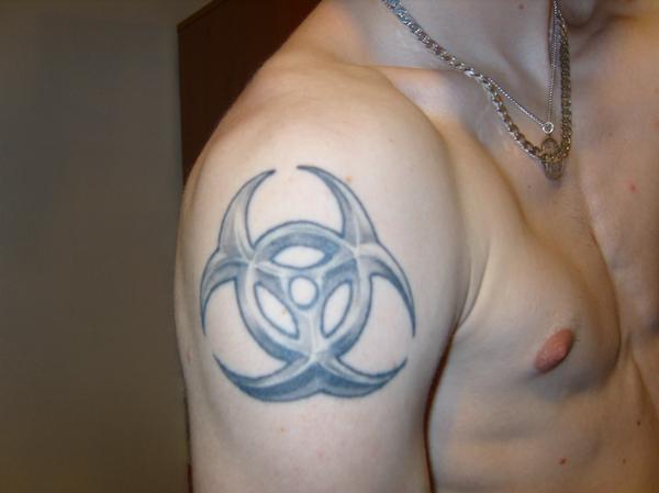 Marvelous Tattoo Of A Biohazard Symbol On Top Right Arm Picture