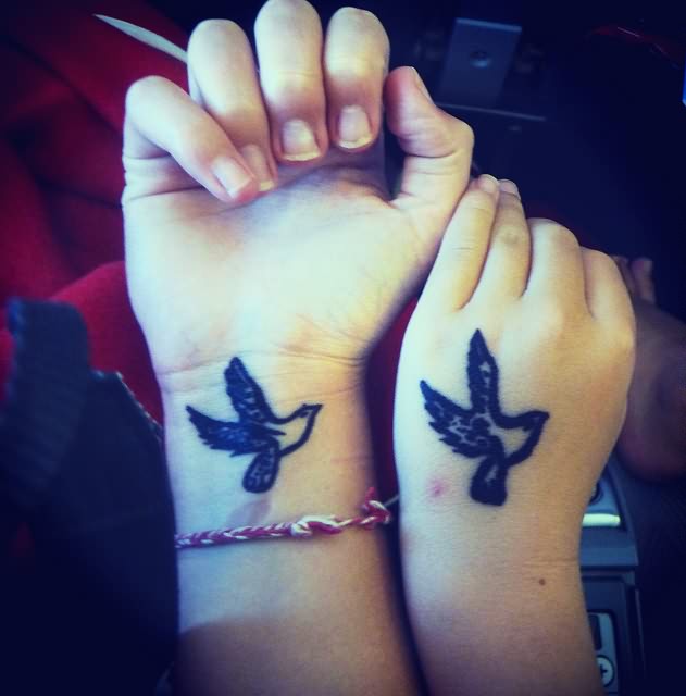 Lovely Duplicated Bird Tattoos On Hand And Wrist