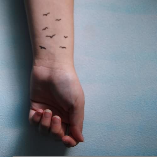 Birds Clump Tattoo On Wrist