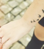 Awesome Five Flying Birds Silhouette Tattoo on Wrist