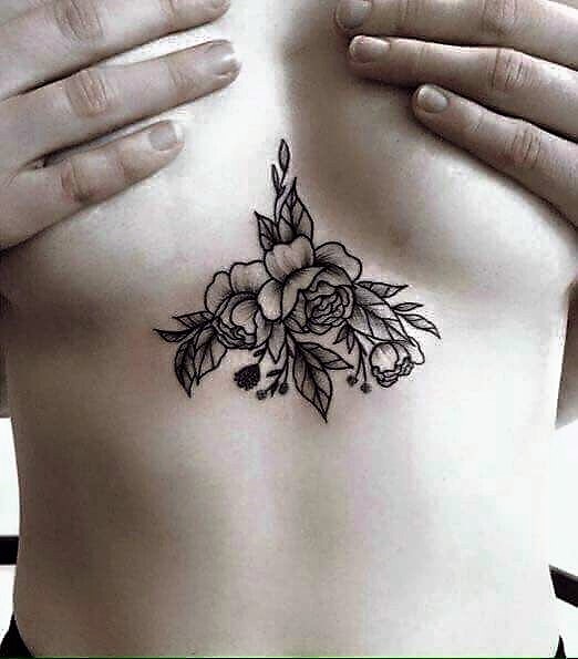 blackwork-flower-sternum-tattoo