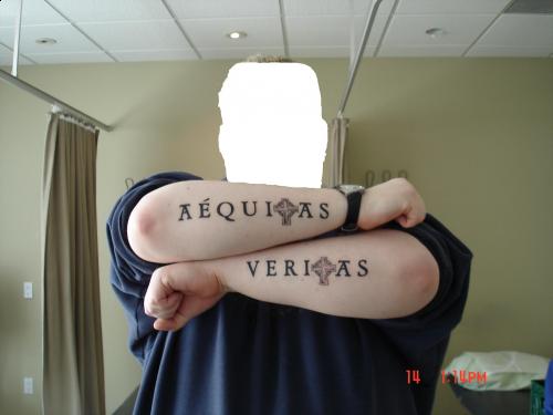 Veritas And Aequitas Tattooed On Forearms, The Words Imply Truth And Justice