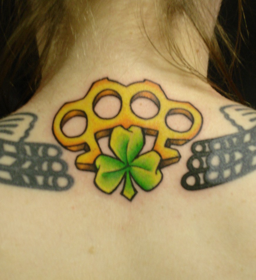 Tattoo of Knuckle on Upper Back