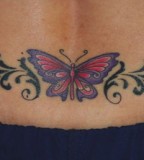Butterfly And Tribal Tattoo On Lower Back